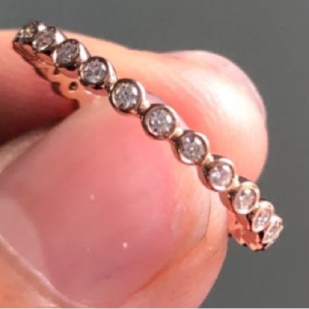 10k rose gold bezel set ring size 5.75 with moissanite stones